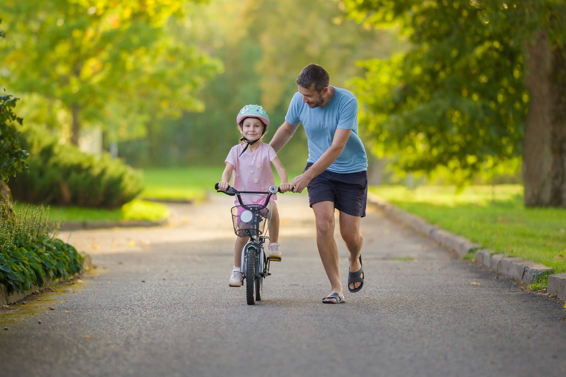 yes-for-meck-community-health-impact-parent-teaching-child-bike