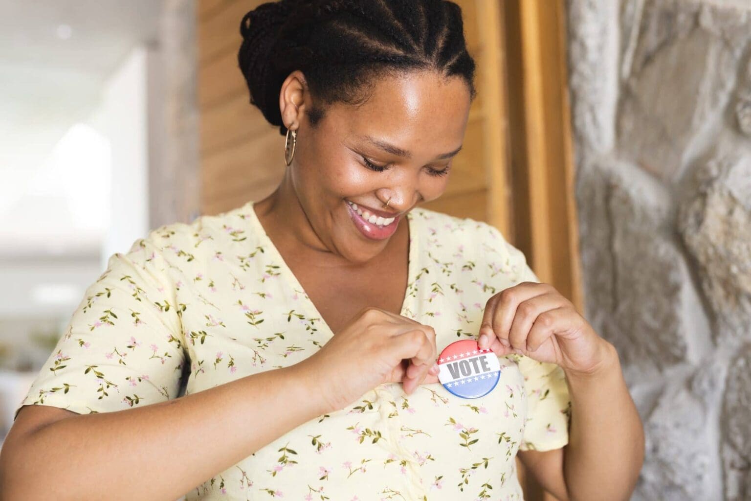 yes-for-meck-voter-education-smiling-woman-with-vote-sticker